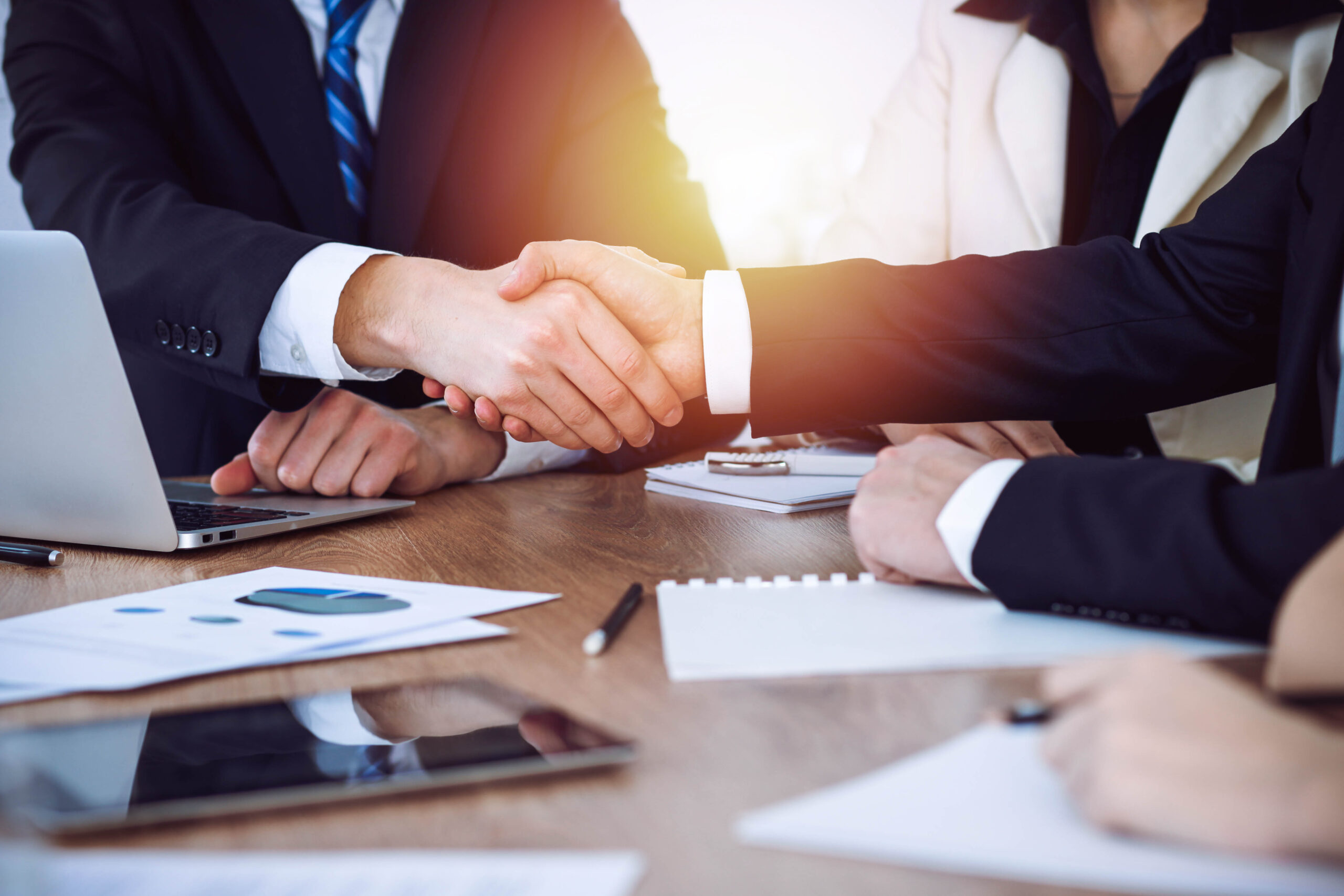Business people shaking hands at meeting or negotiation in the office. Handshake concept. Partners are satisfied because signing contract