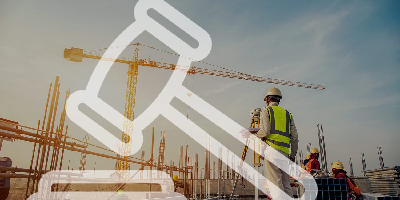 Surveyor builder Engineer with theodolite transit equipment at c